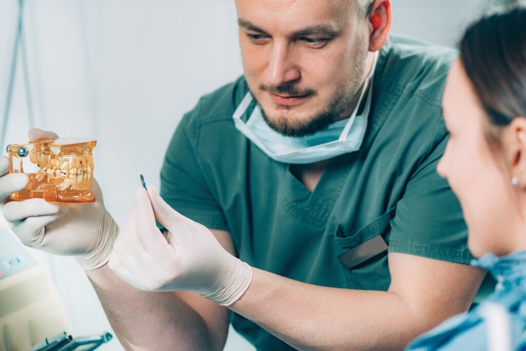 Dentist explaining dental implant procedure to patient